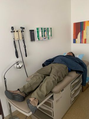 I took a nap on my physician spouse's examination table. She took this photo because she thought it was a homeless man waiting for... I dunno, a pap smear or something.