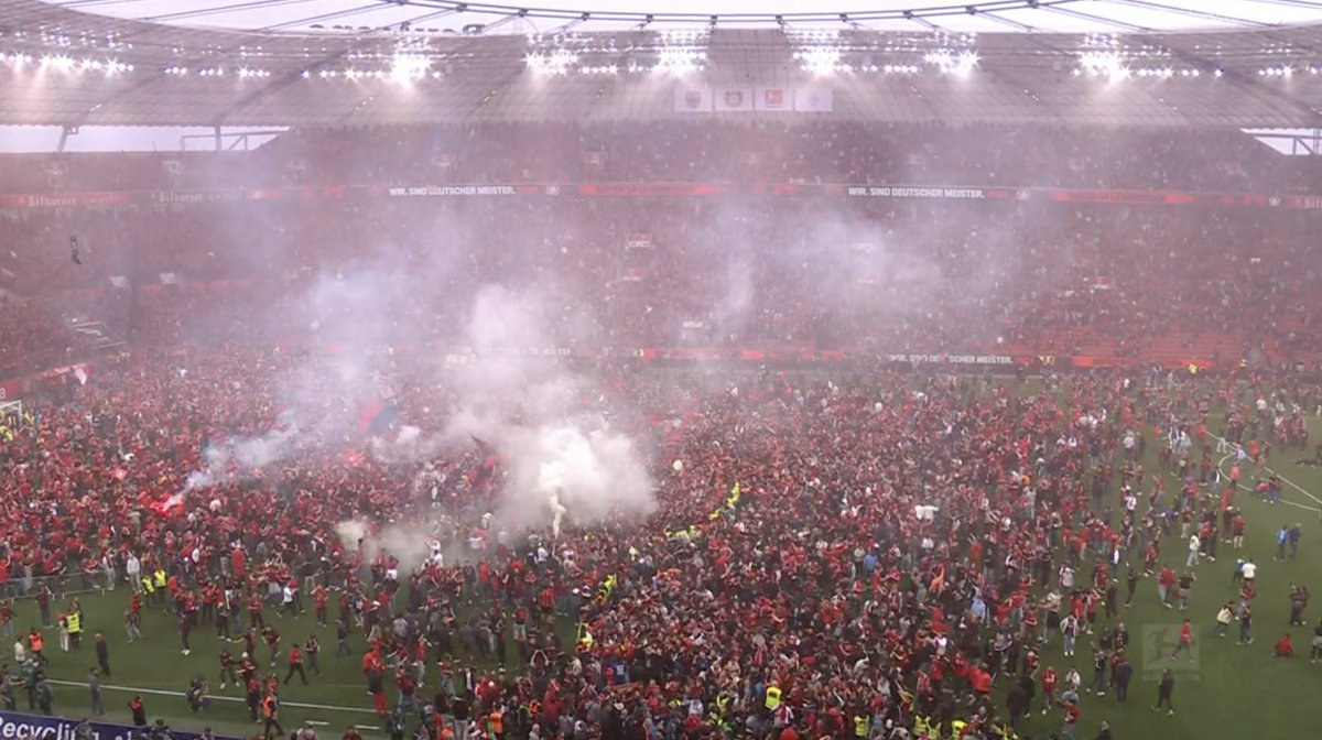 Now that's a pitch invasion! Srangely, Land of Hope and Glory plays out over the PA system as #Leverkusen claim their first ever #Bundesliga.