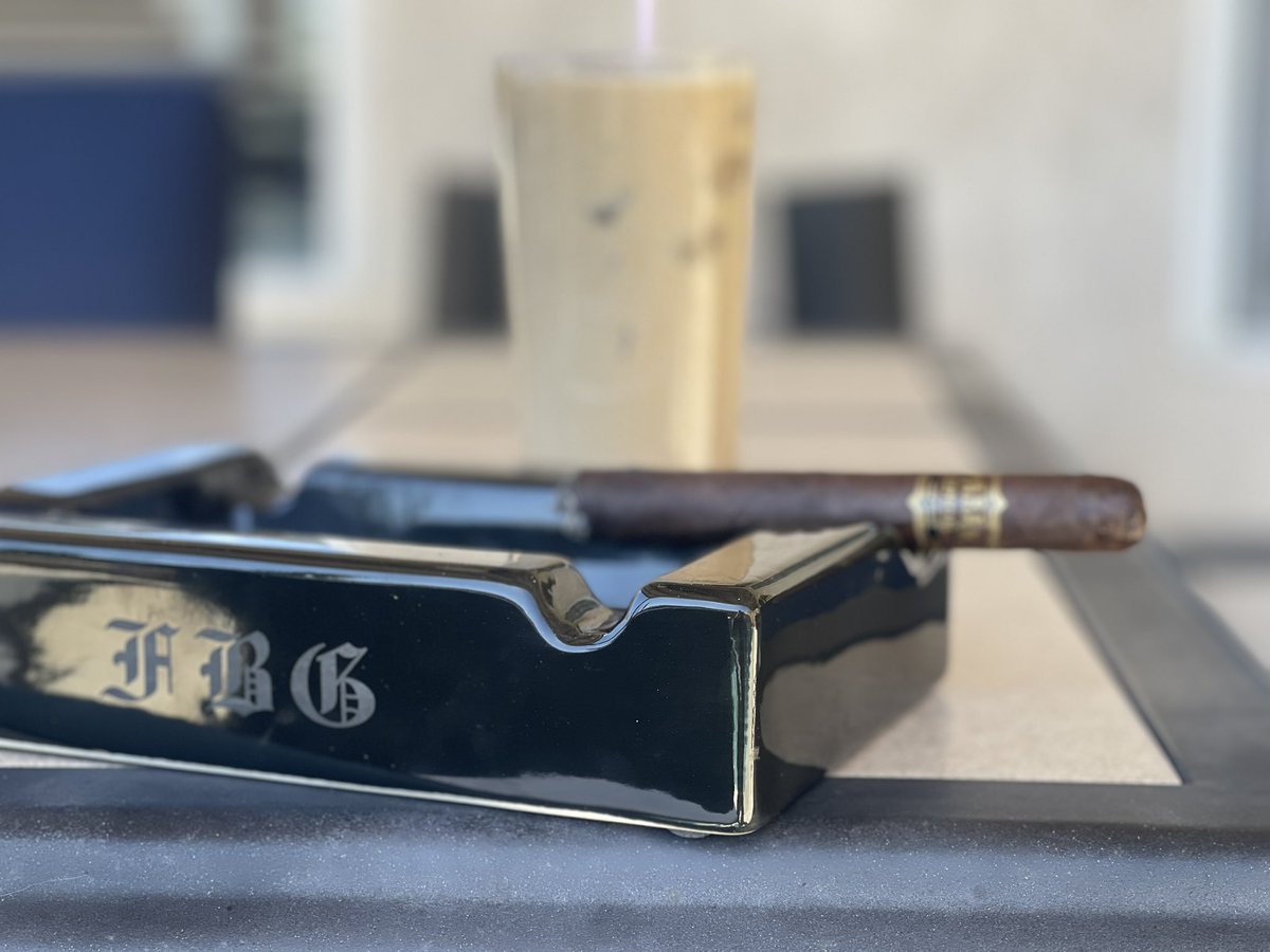 Early @Angels game, one of my favorite smokes from @drewestatecigar , a wonderful Tabek Especial Toro Negra 6x52, paired with an iced coffee. Great Sunday. It’s good to be #KingofTNA