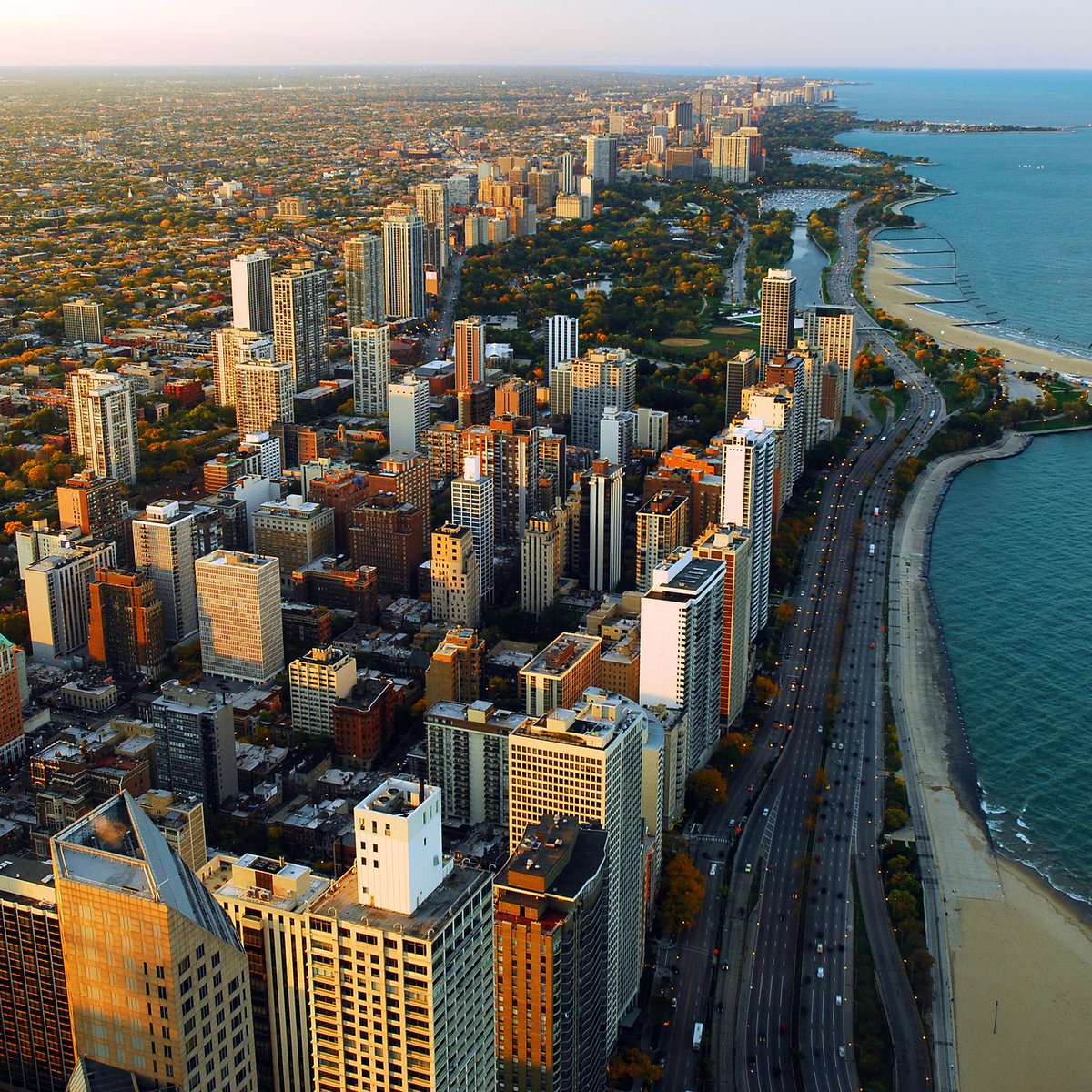 Chicago's beautiful Lakeshore Drive. Dense apartment complexes constructed for miles, almost right up to the waterfront. Relatively affordable. Long stretches of public beach, accessible by underpass. RT to scare the California Coastal Commission.