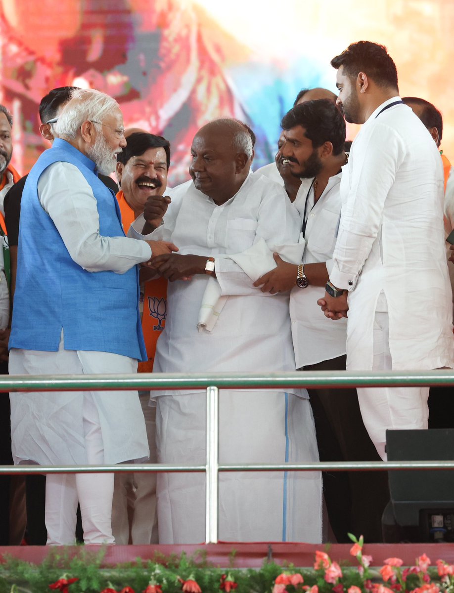 narendramodi's tweet photo. The public meeting in Mysuru was phenomenal. The support for @BJP4Karnataka and @JanataDal_S across all parts of Karnataka is remarkable. People are fed up of Congress and want our alliance to win. It was very special that our former PM and respected statesman @H_D_Devegowda JI came for the rally and shared his thoughts.