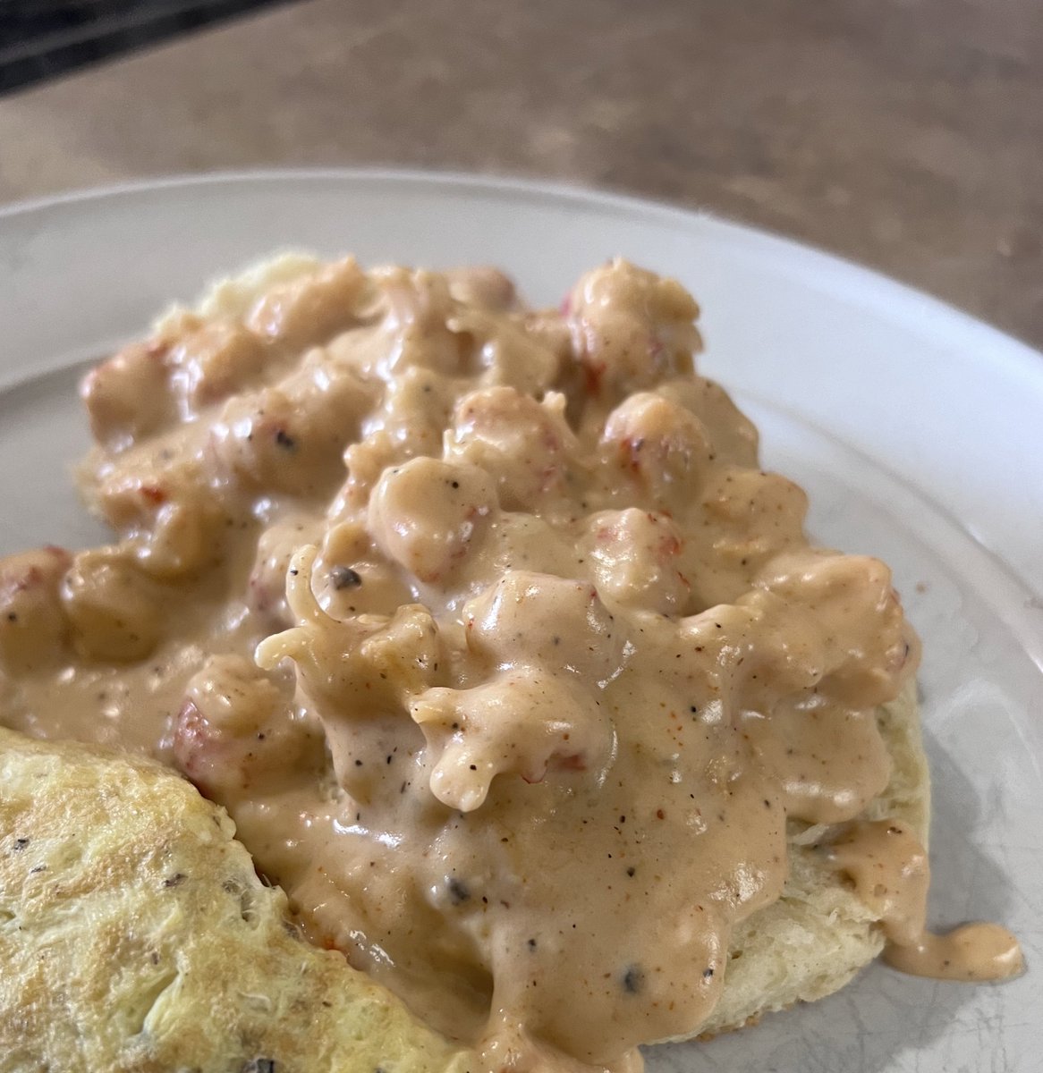 Biscuits and crawfish gravy Okay.. I couldn’t get the best picture of it plated and I was hungry, so this the best y’all getting today 😂 This recipe been in my head for a few years and I decided to give it a try today. Bitch I wanna kiss myself right now😩