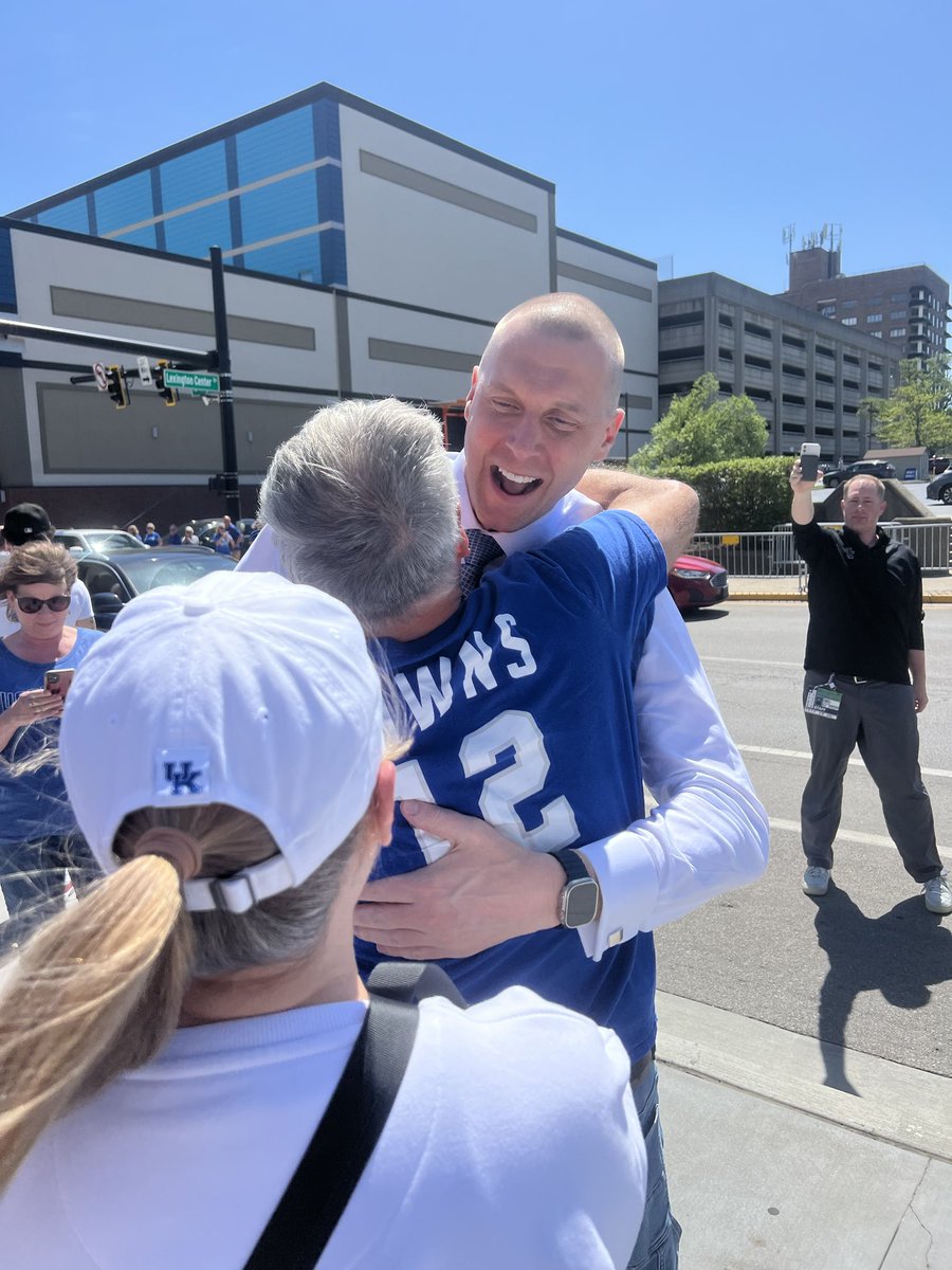 Mark Pope pulled up in front of the crowd and got out and began hugging fans