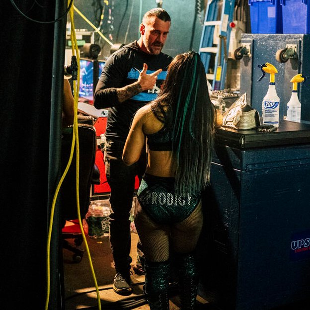 CM Punk talking with Roxanne Perez on the Raw After Wrestlemania