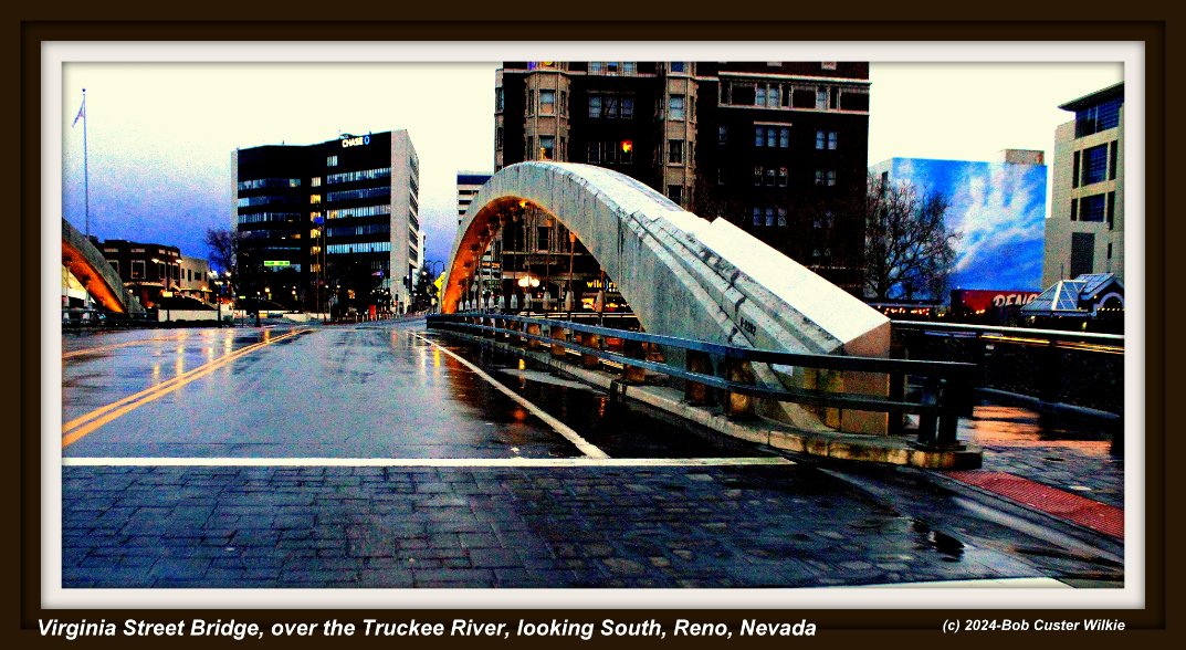 GeneralGCuster's tweet photo. Virginia St . bridge in Reno, NV, on a rainy day,over the Truckee River. Right: The Riverside artist lofts. Was the famed Riverside Hotel Casino, where Frank Sinatra & Paul Anka sang. @HistoryNevada @andrewssports @MadisonMacayTV @TheJuliaNelson (#RandomNevada) https://t.co/NEU7GW2G6N