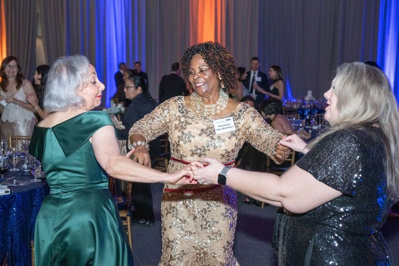Professors Fran Tetunic, Florence Shu Blankson, & Heather Baxter join the throngs on the dance floor at the NSU Law 50th Anniversary Gala.
