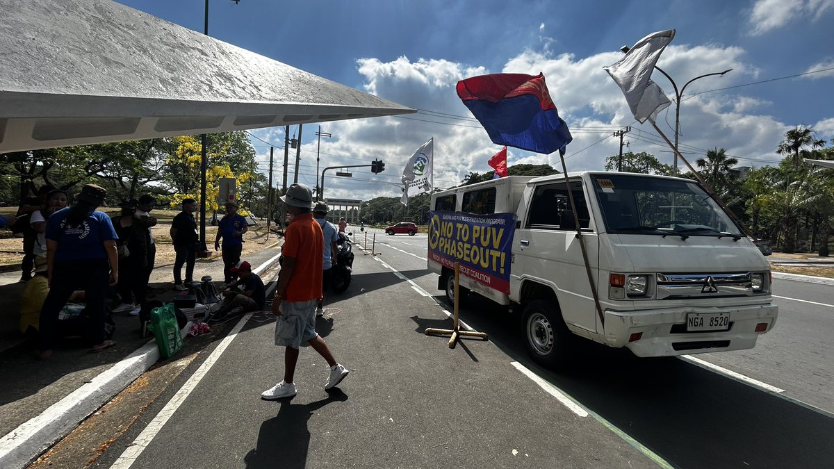 LOOK: Transport groups Manibela and Piston gather at University Avenue in UP Diliman to stage a protest against the deadline of PUV modernization program on April 15. The DOTr sets the deadline on April 30. | @dMorcosoINQ