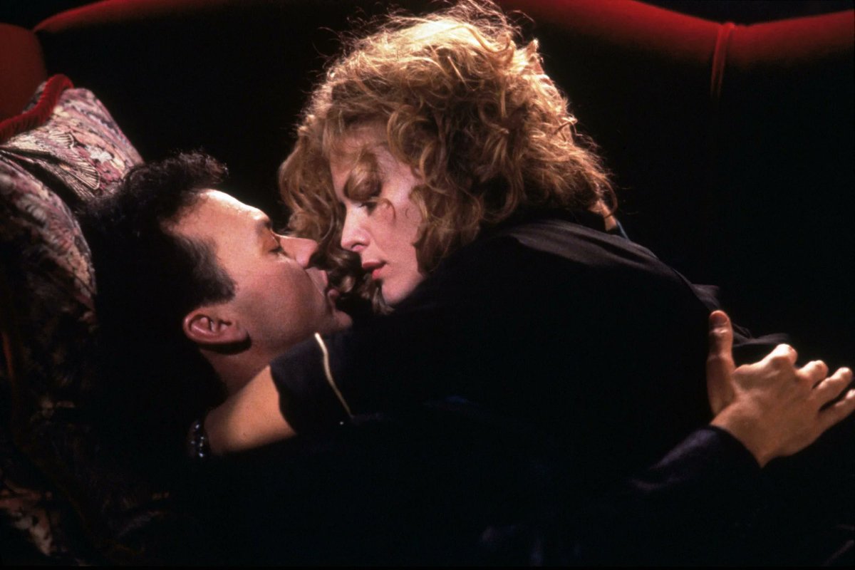 Production Photo from Batman Returns, with Bruce Wayne (Michael Keaton) and Selina Kyle (Michelle Pfeiffer) getting up close and personal. To quote the trailer: 'She craves a romance she can sink her claws into'.