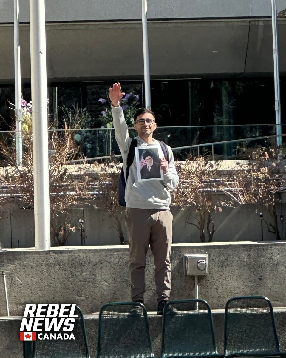 Today, during the anti-Israel rally in Calgary, a protestor was seen giving a Nazi salute while holding an image of the Iranian Supreme Leader, Ayatollah Ali Khamenei. This comes a day after Iran attacked Israel. DeportHamas.com