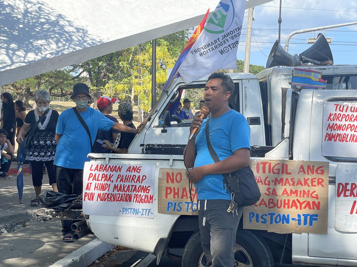 LOOK: Transport and progressive groups assemble at University Avenue, UP Diliman to assail the government's railroading of the anti-people Public Utility Vehicle Modernization Program (PUVMP). At the end of the month, the livelihoods of PUV owners, including jeepney drivers, are