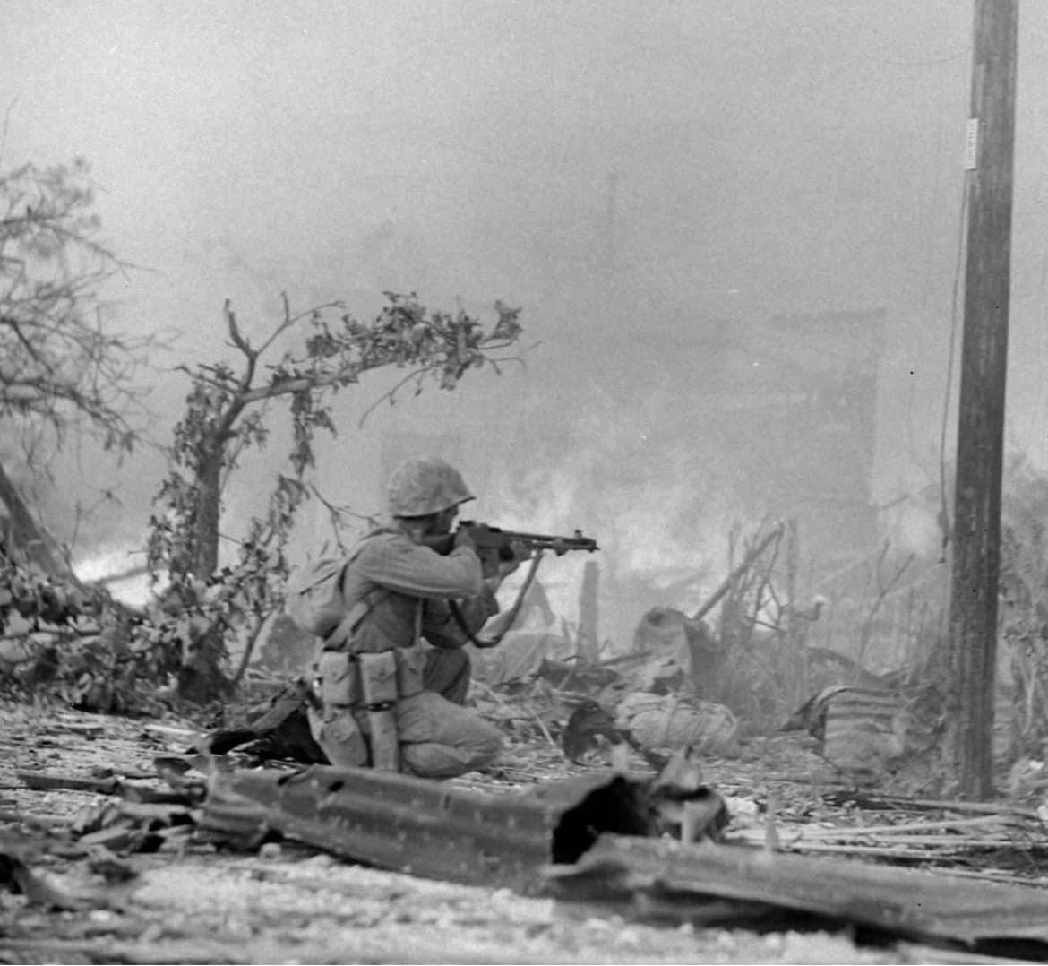 During heavy fighting on Saipan, a Marine takes aim at the enemy in the summer of 1944. 🪖
