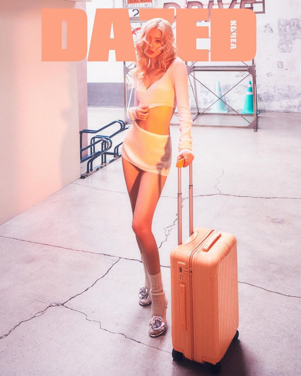 How would you handle the heat of this pose? Clutching onto RIMOWA and hey, let me serve some looks straight to the camera. Just to let you know, the old Rosé isn't available at the moment.