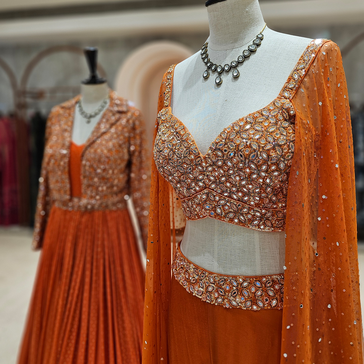 Orange Crush 🌟  Sunshine vibes all around with this bright orange outfit along with mirror work that adds some serious sparkle✨  Don't miss out on our fabulous finds!💫  #neerusindia #neerus #neerusfashion #newcollection #ethnicwear  #lehengas #bridal #gowns #sarees #fusion