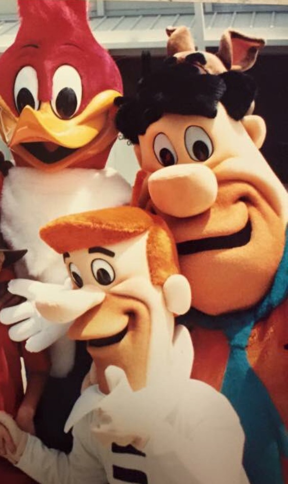 Hanna Barbera icons Fred Flintstone and George Jetson stand with Woody Woodpecker.

- Universal Studios Florida (1990s).
