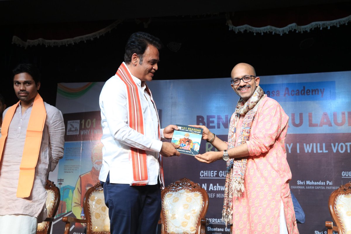 shantanug_'s tweet photo. The Bengaluru welcome of “101 Reasons, Why I Will Vote for Modi” was super grand.

Dr Ashwath Narayan - @drashwathcn former deputy Chief Minister of Karnataka detailed PM Modi’s welfare schemes for the poor.

Mohan Das Pai, @TVMohandasPai detailed the strong economic trajectory that India is taken under PM @narendramodi.

@shaziailmi, in her electrifying speech, emphasized that vote for Modi is a vote for our own family’s better future. 

@iamanilshetty & @sapthagirigowda expressed full confidence that BJP will score 28/28 in Karanataka.

Vande Matram and Bharat Mata Ki Jai roared in Basava Bhavan at Central Karanataka, not very far from the Vidhana Soudha.