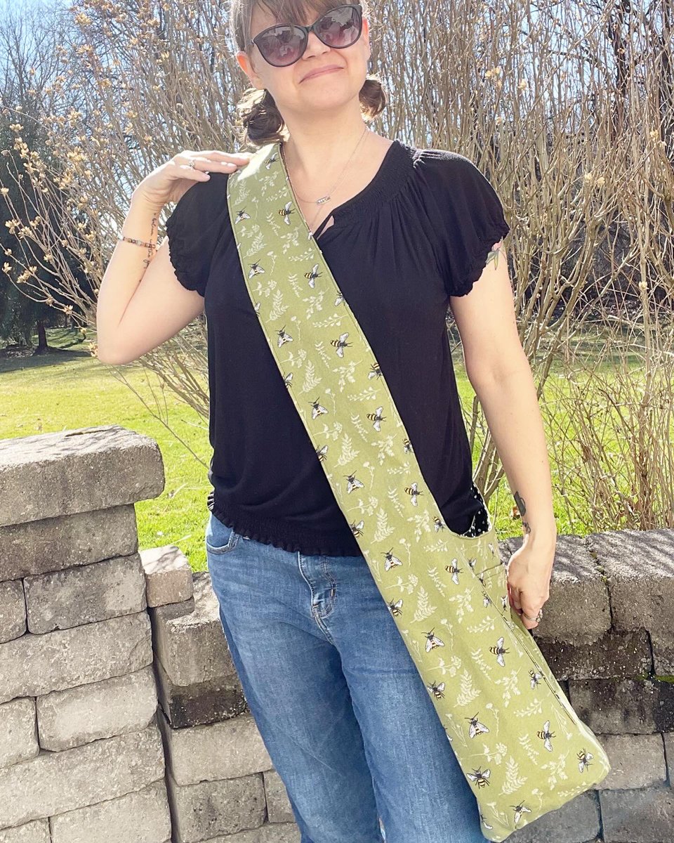 kuddlebumz's tweet photo. I love bees! Hopefully the midwest will bless us with May flowers soon so the bees will be back swarmin’. This crossbody bag is green canvas with bees and lined with a black cotton with white polka dots. It’s reversible and washable. Find it at https://t.co/vwP3bOFxTA 
#bees https://t.co/5qAwzMe5HD
