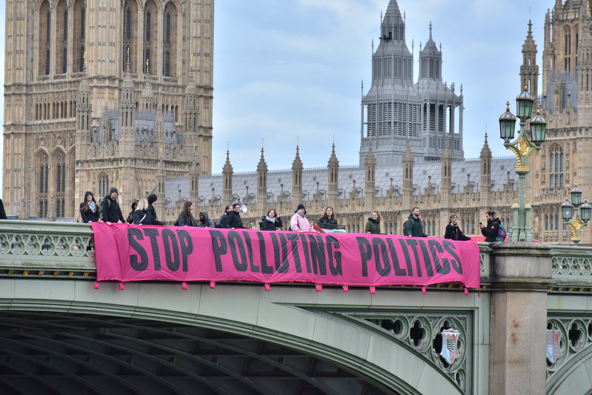 BREAKING: We're on Westminster Bridge demanding that politicians cut their ties with the fossil fuel industry. MPs are lining their pockets with oily money whilst slamming the brakes on climate action - it's time we fight back! #stoppollutingpolitics