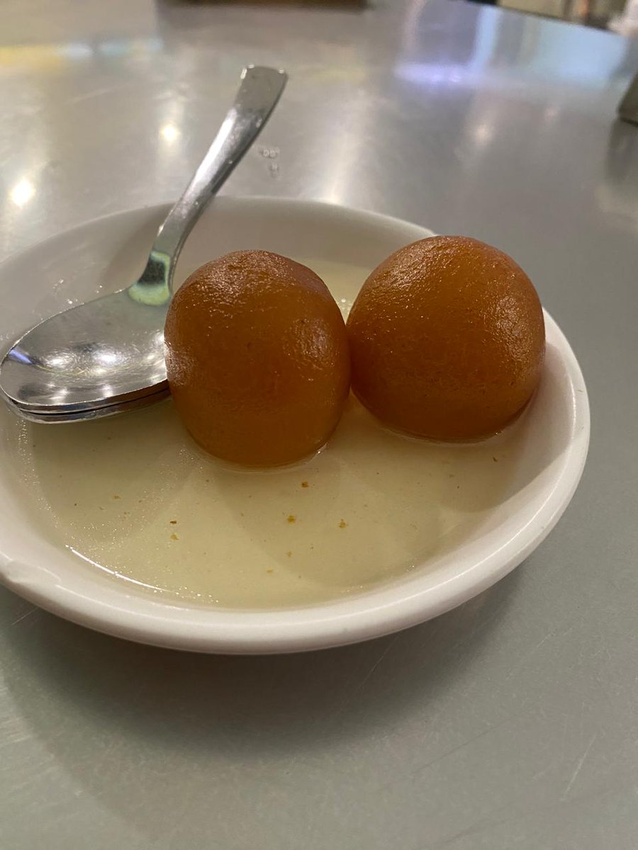 'Sweetness perfected: Dive into the delectable world of Gulab Jamun! 💖 These golden balls of goodness, soaked in fragrant sugar syrup, are the ultimate treat for your taste buds. Experience pure bliss with every bite! #GulabJamun #IndianSweets #SweetTreats 🍬✨'