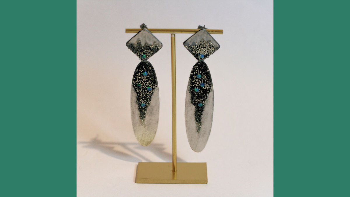 The elegant Dragon Oval Earrings by Francesca Marcenaro have been crafted out of marcasite and syn opal set in oxidised silver. She uses the 'glass granulation' technique to create a bead-like texture that adds a distinctive yet soft sparkle to her pieces. #glassgranulation