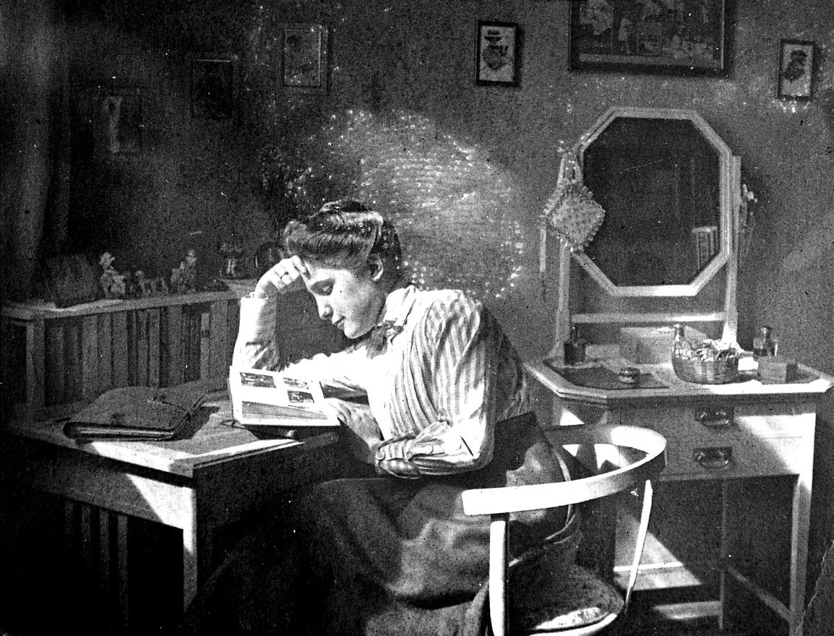 Girl reading in her room, 11 Rákóczi Avenue, Budapest, Hungary 1910.