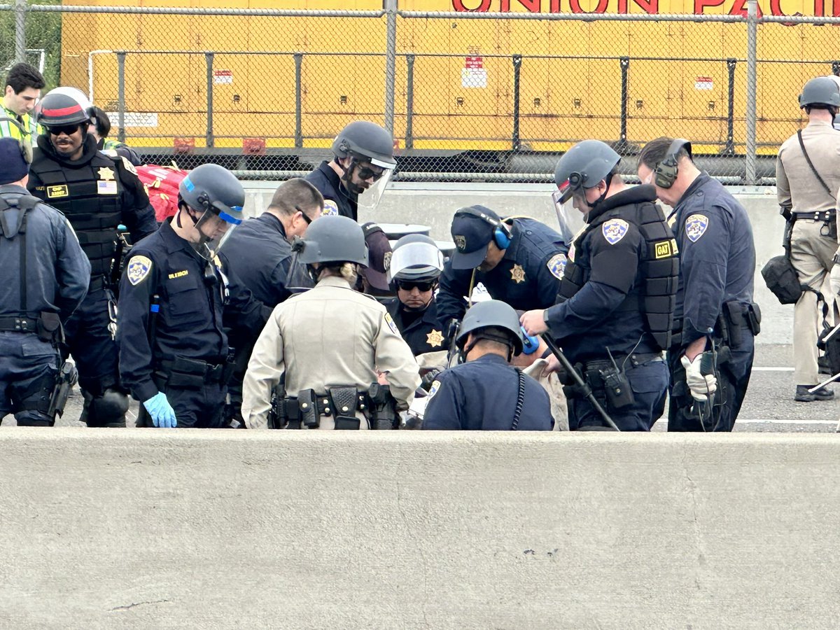 What’s made things challenging in getting NB880 open is protestors have their arms inside of these drums via pipes with concrete used inside. Officers are methodically cutting away the parts while also making sure the protesters aren’t injured as they work.