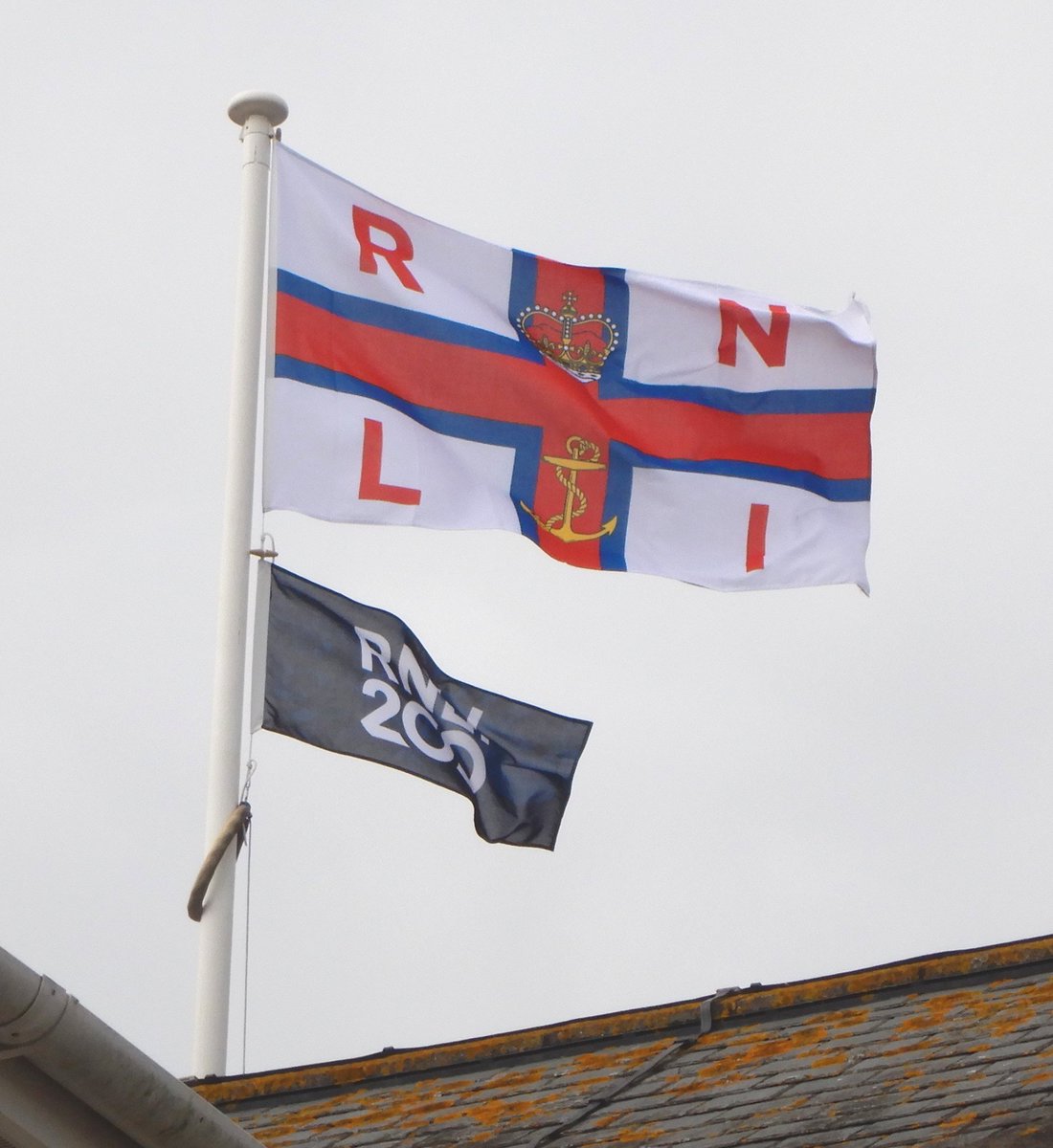 LhamptonRNLI's tweet photo. It's a blustery day, but if you are out and about and passing the RNLI boathouse at Fisherman's Quay look up and you will see we have an extra flag up on the mast this year to commemorate 200 years of our volunteers saving lives at sea thanks to all your generous support. https://t.co/QxgbLBEJrf