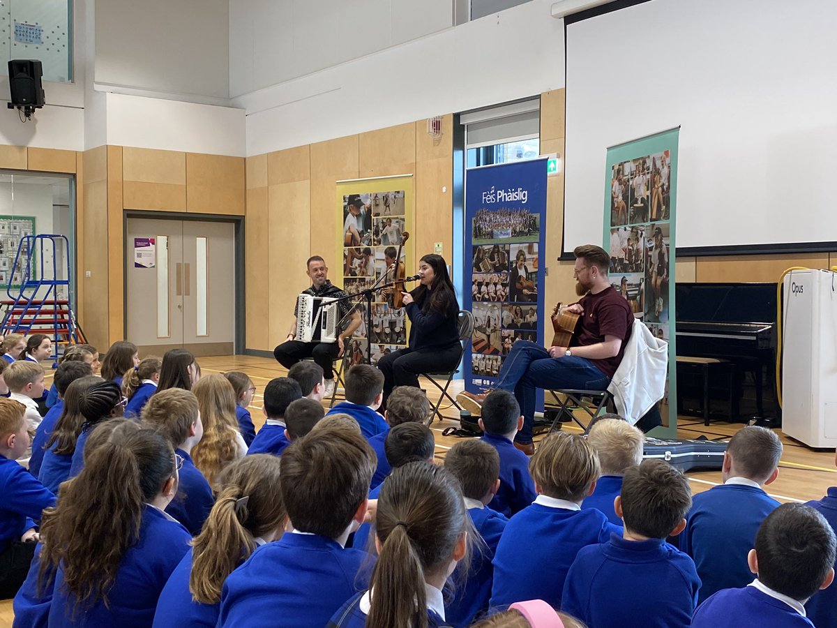 Our whole school had a fantastic visit from @feisphaislig this morning. We learned some Gaelic phrases, listened to traditional music and talked about the instruments they had brought in. We have lots of pupils keen to come along to the summer festival! Thank you!🎵