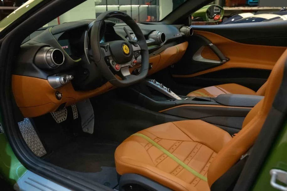 The verdant green paintwork is Verde Medio Niyinski. Inside, the the upholstery is in sumptuous Poltrona Frau Furniture Leather in SC 68 Sahara. The tan shade, with green accents to echo the exterior, completes the legendary and timeless green-over-tan color combo.