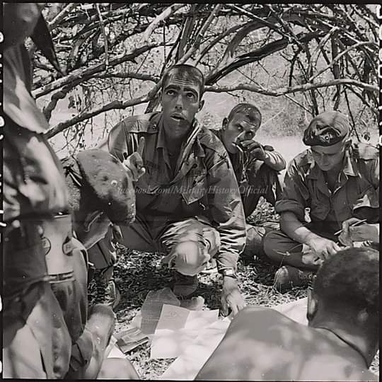Phan Rang, Vietnam....First Lieutenant Tovar of the Recondos gives instructions to his squad leaders while on Operation Farafot IV., March 18, 1967. Credit: Military History.