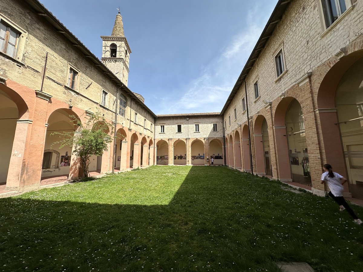 The "Faces of Innocence" now hangs at Scuola Sedondaria di 1º Grade in Cagli, Italy, inside an ancient monastery of the San Francesco Church cloister.