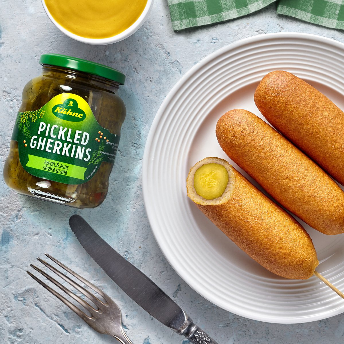 Corndogs with a pickled twist 🥒 And of course, a side of Medium Hot Mustard 🤤 #corndogs #pickle #gherkins