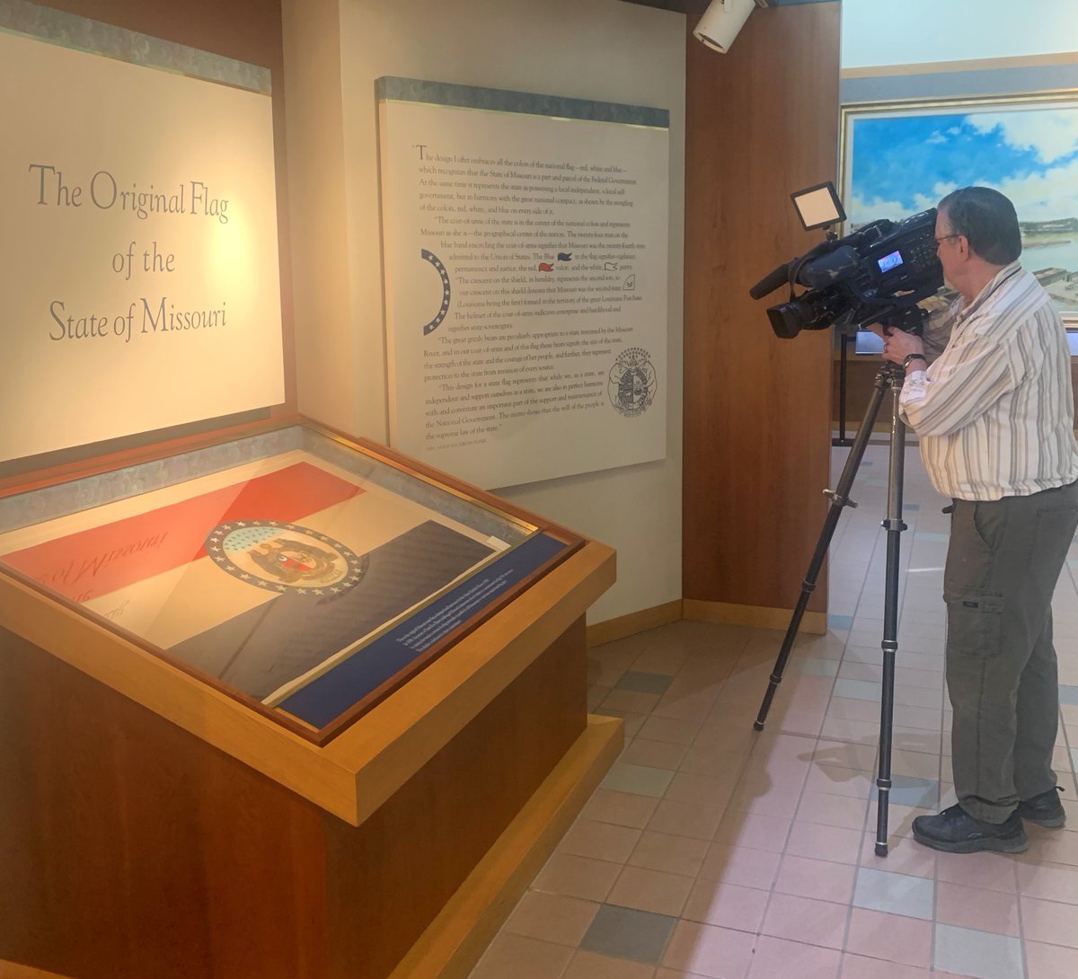 Today Marie Watkins Oliver, the designer of the Missouri State Flag, was inducted into the Hall of Famous Missourians at the Capitol. @KRCG13’s Kermit Miller visited our office this afternoon to film the display of Oliver’s restored original silk flag. #moleg