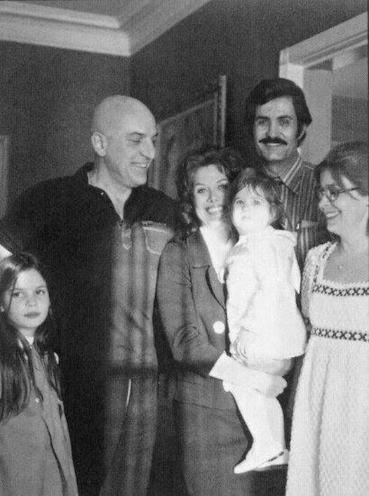 Classic Retrovision Milestones · Follow 1d · Check this out - Little Jennifer Aniston in the arms of her mom, Nancy Dow, with dad John Aniston and Jen's godfather, Kojak himself, Telly Savalas