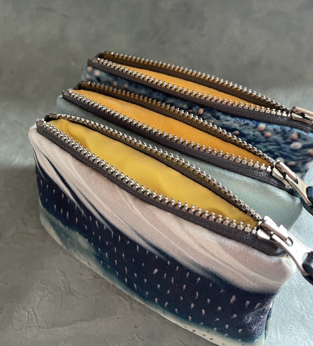 Finished up this custom order. Velvet purses with hand-dyed gorse flower linings.
