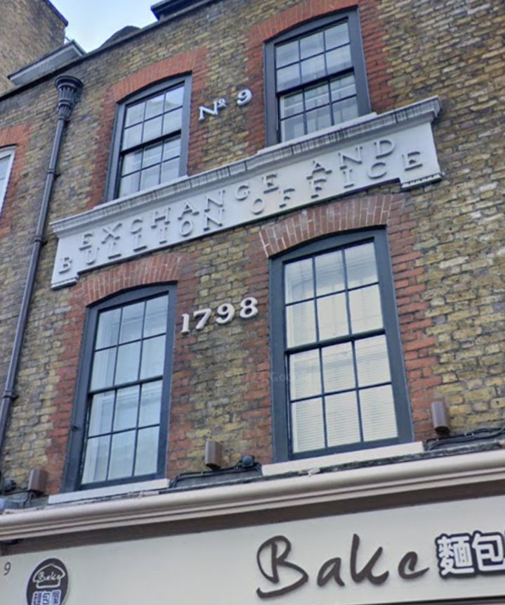 The Ghost Sign of the Exchange and Bullion Office, 9 Wardour Street, Soho. The building was built in the 1720s, but during the reign of George III in 1798, it became the Exchange and Bullion Office, owned by a goldsmith dealer named Benjamin Smart.