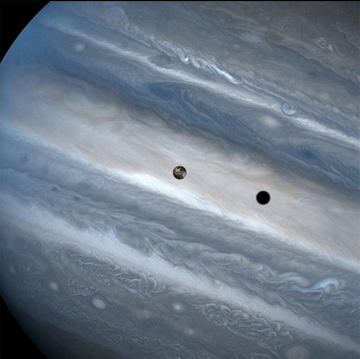 This is a photo of Jupiter's moon Io eclipsing the Sun.

Io is in the centre of the image; its shadow is the darker circle to the right.