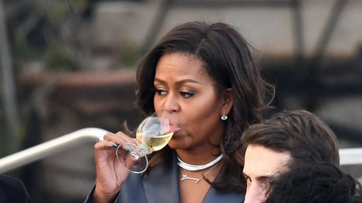 Babygravy9's tweet photo. Five years after the burning of Notre Dame and we still don't have an adequate explanation for why Michelle Obama was present to observe the fire from a riverboat while drinking champagne. https://t.co/bJzLNd73Qd