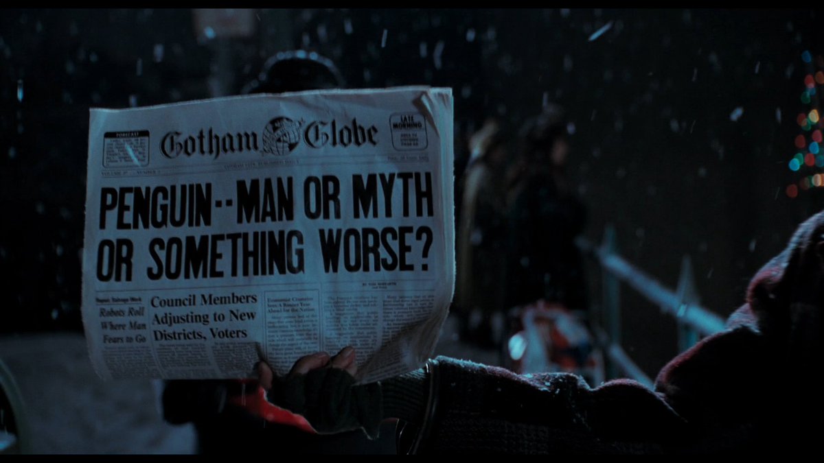 Photo of (the prop of) Vol. 27 Issue #3 of the Gotham Globe with a headline about the mysterious Penguin Man, as seen in Batman Returns near the start of the film. The article says that 'The Penguin Creature' was last seen torching a homeless shelter and robbing a blind vendor.