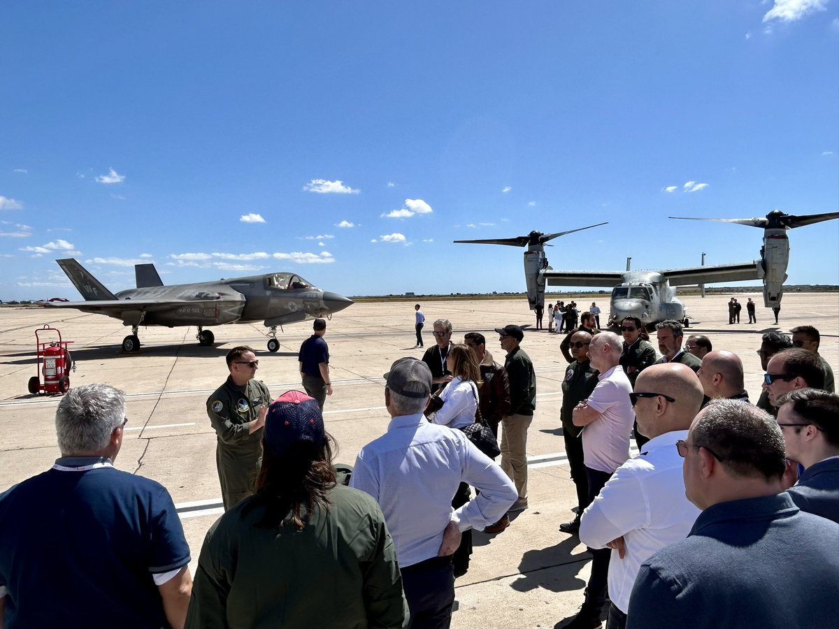 ScottZoldi's tweet photo. #FICOWORLD24 TAKEOFF! What a thrill to welcome @FICO customers to the #FICOWorld Exec Experience at the Naval Air Station #Miramar, in my #SanDiego backyard. We toured the F35-B Lightning II fighter &amp; Osprey multi-mission aircraft. Great to hang with FICO co-inventor Julie May! https://t.co/0qjwyhbcIa