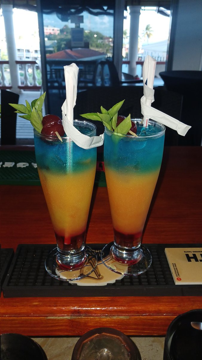Great drinks comes in twos 🍹🍹 Grenadines syrup Bols strawberry . Orange juice Bols Triple sec . Blue curacao Sunset strong rum #harrydmixologist #mixologist #cocktail #stvincentandthegrenadines #caribbean
