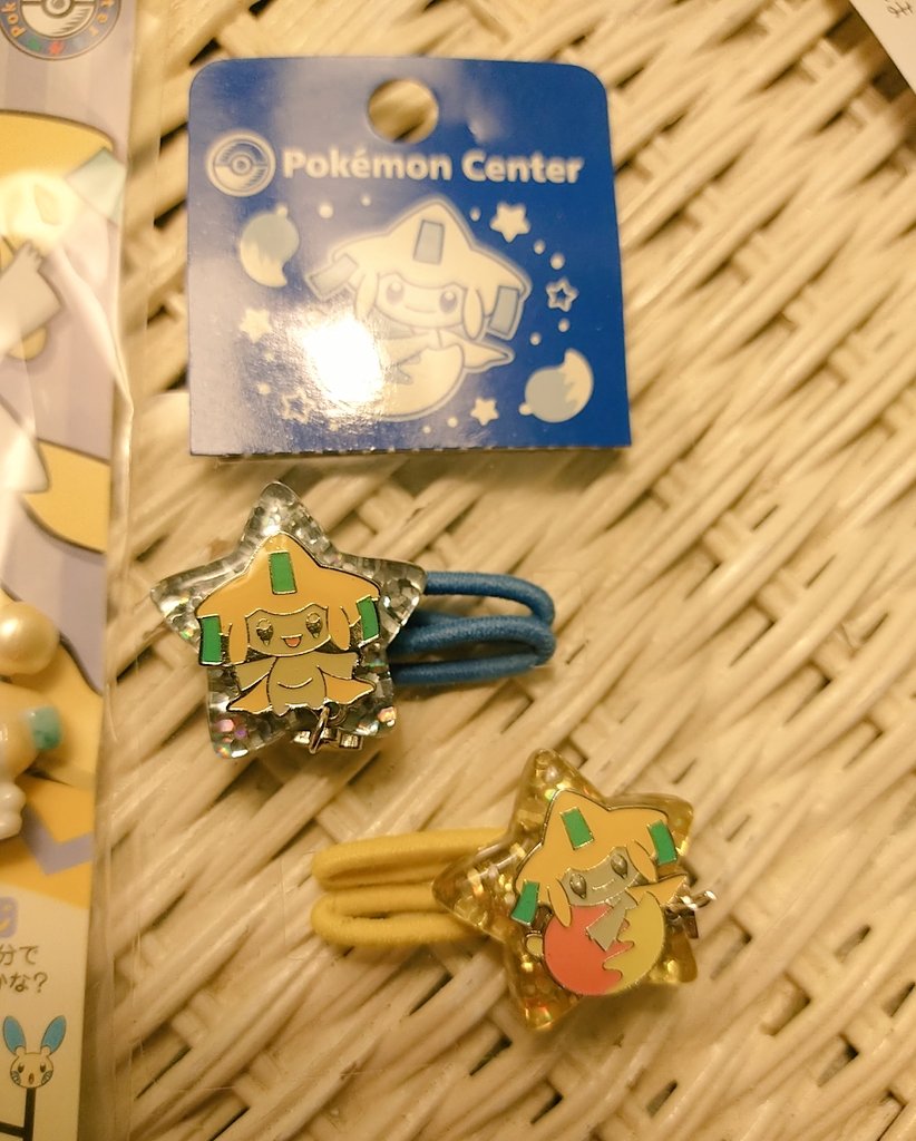 some recent pokémon center finds- jirachi ceramic bell charm from 2005 and jirachi hairties from 2003! the hairties are so cute, i almost want to use them but i don't want to break them 😭