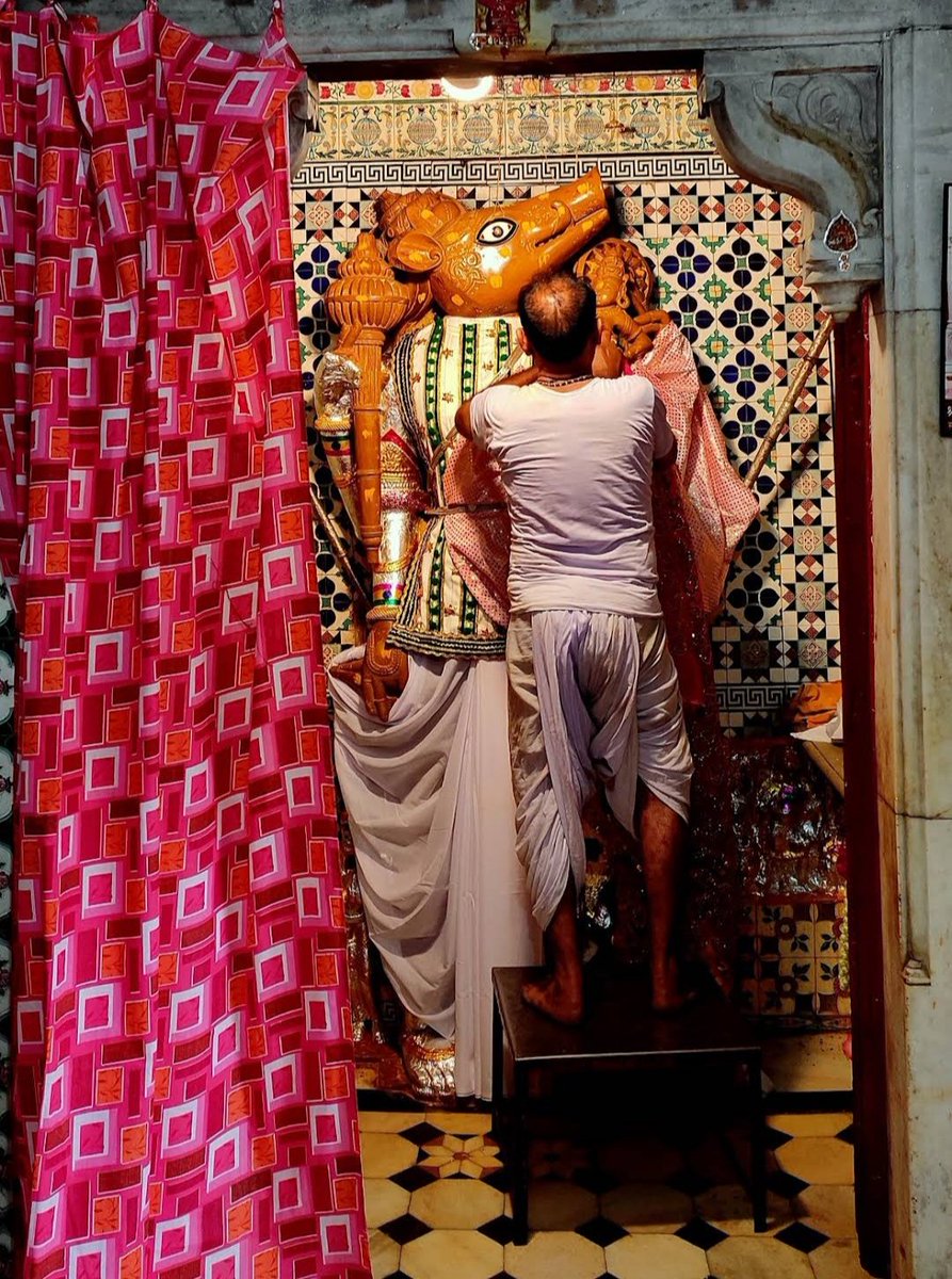 Life size image of Varah Avatar of Vishnu made of yellow stone at Varah Shyam temple, Bhinmal (Rajasthan). Image of Bhudevi rescued by Varah from depth of the ocean can be seen alongwith.