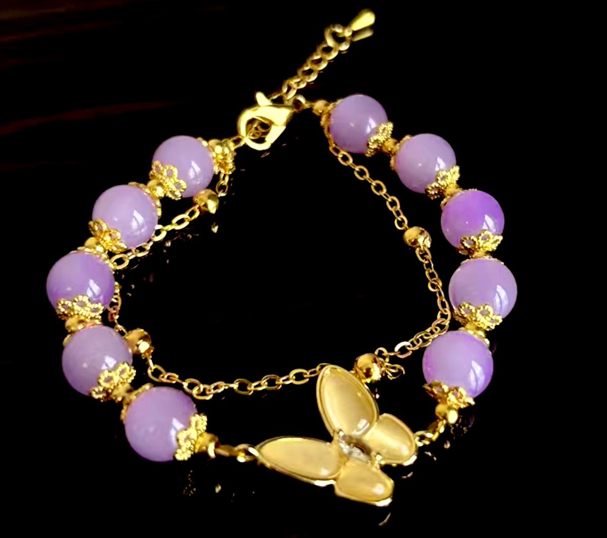 A purple stone, butterfly chain bracelet. I personally love the color. 

#Jewelry #Purple #Stones #Beads #MercyAmari #Handmadejewelry #Chain #Butterfly