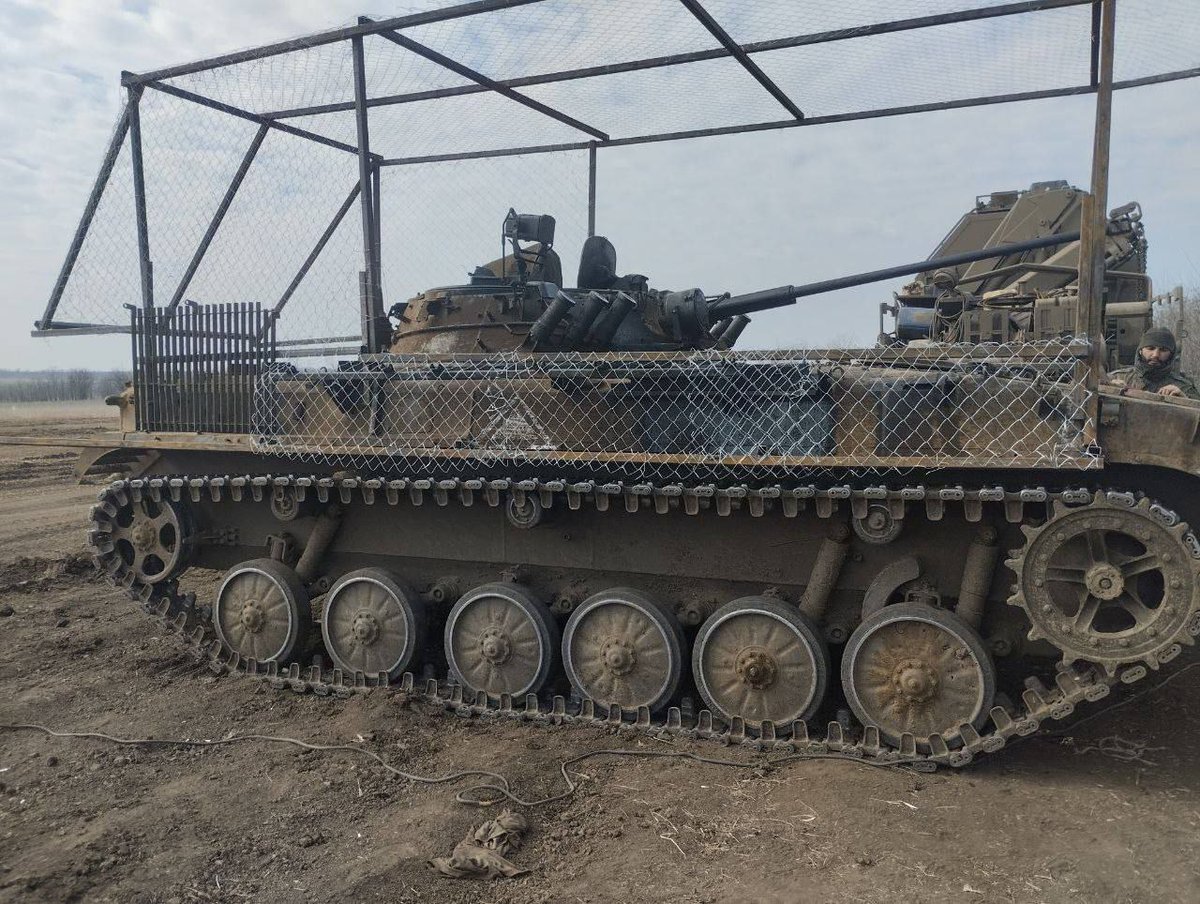 15 March 2024 Russian-occupied #Zaporizhzhia Oblast, #Ukraine Russian equipment with anti-drone cages, including a BTR-82A, BREM-1, and BMP-2.