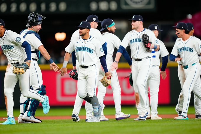 Mariners high five after tonight's win.