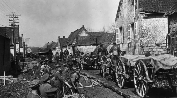 Canadian troops construct plank roads to allow heavy traffic to pass after the battle of Vimy Ridge, France, in April 1917