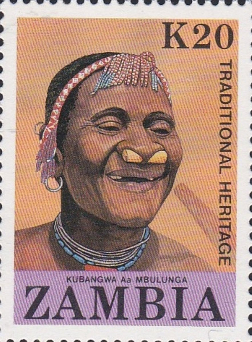 The stamp celebrates Tonga heritage, the practice of Kubangwa, the removal of four front teeth, the wearing of the nose accessory called Chisita and the traditional head dress, called ichiyayale made from bulungu or beads.