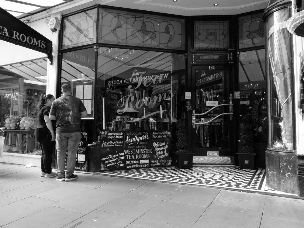 SOUTHPORT 13-04-24.
On Lord Street, the Westminster Tea Rooms. 
#Southport #LordStreet #streetphotography #blackandwhitephotography #WestminsterTeaRooms