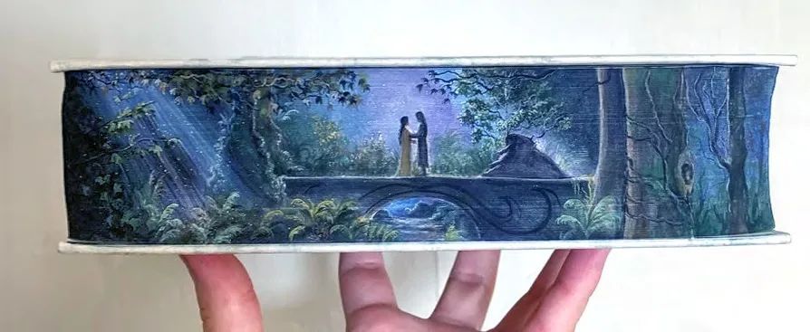Faeriemagazine's tweet photo. Maisie Jackson is a master at #foreedge #painting, the #art of rendering the heart and soul of a #book on the too often neglected page edges. Her detailed #watercolors make every surface sing. https://t.co/OeJaBrOn9y https://t.co/g6H6qOYrm7