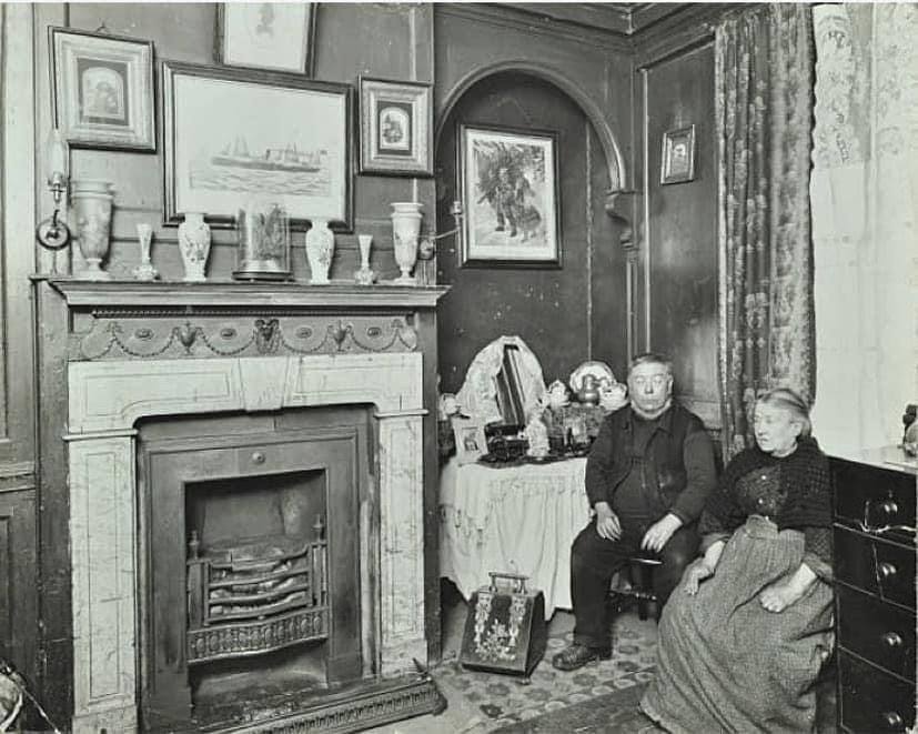 An elderly couple in Victorian Interior, Albury Street , Deptford, London. 1911.
>FH